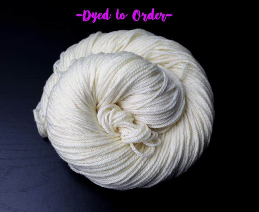 A white skein of yarn in a spiral with the words Dye To Order above it.