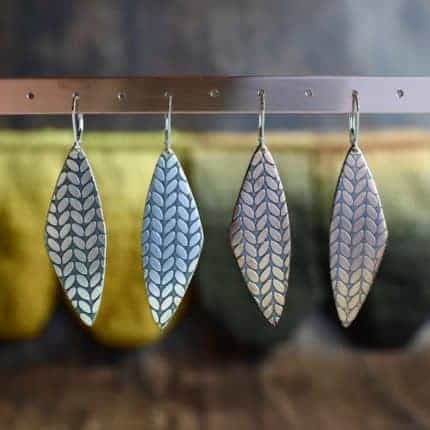 Stockinette and garter stitch metal earrings.