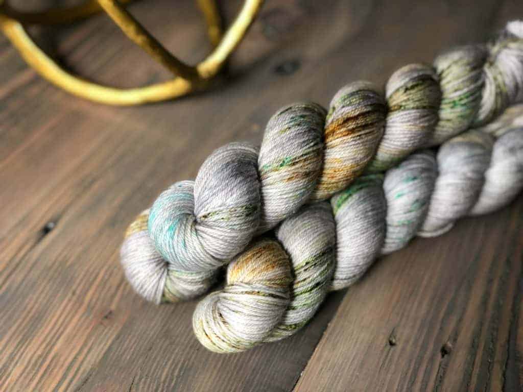 Gray yarn with green, gold and aqua speckles