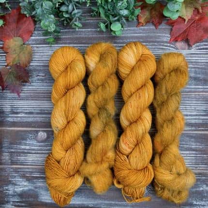 Four golden skeins of yarn