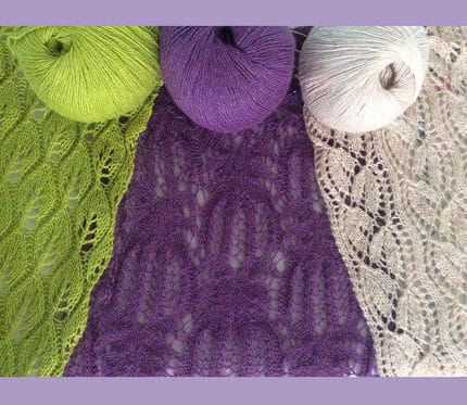 A lace scarf in lime green, purple and ivory