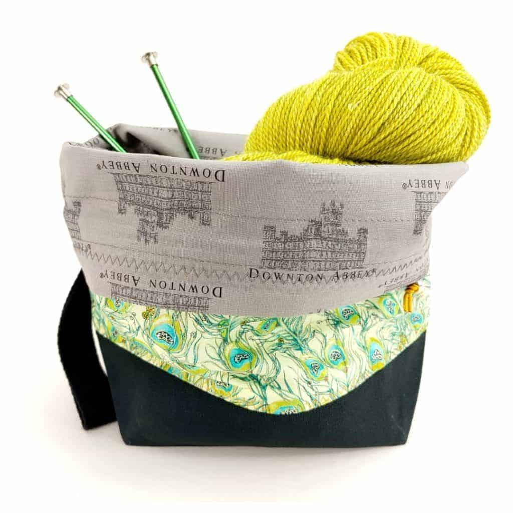 A green floral bag with a gray Downton Abbey lining