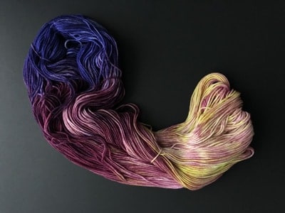 Blue, pink and yellow variegated yarn untwisted