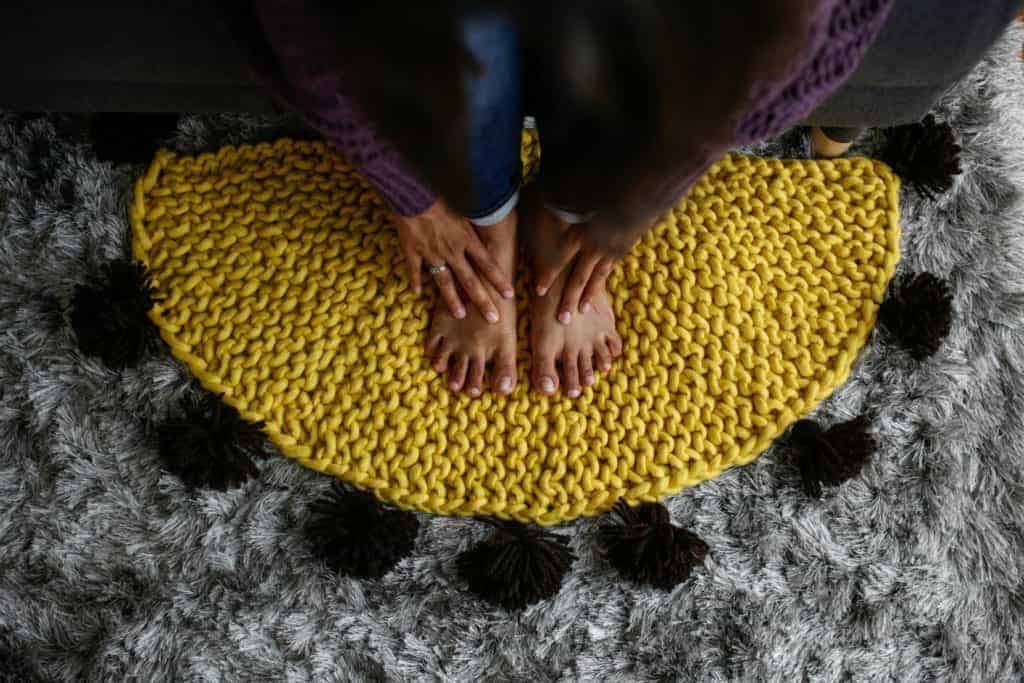A yellow knit rug.