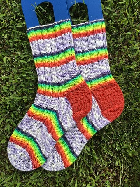 Gray and rainbow striped socks.