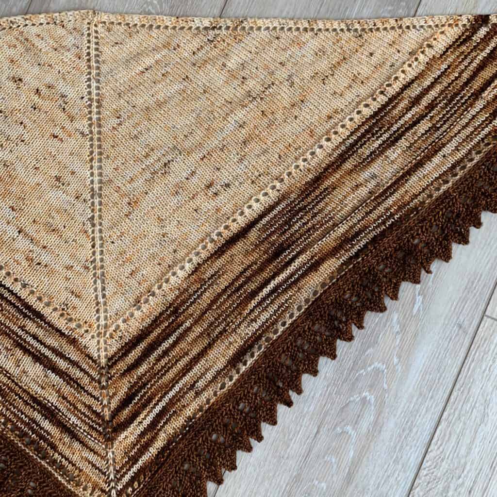 A cream and brown shawl.