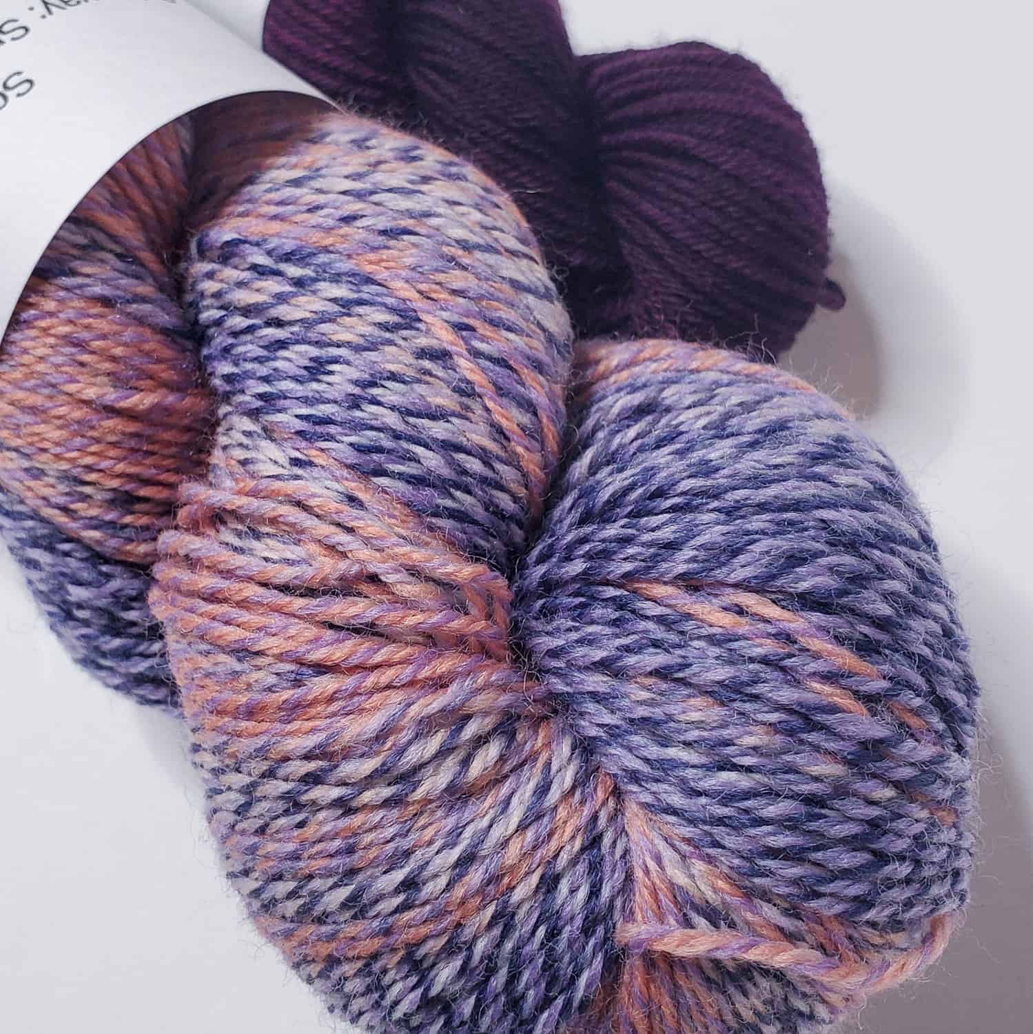 Handspun look yarn with shades of purple.