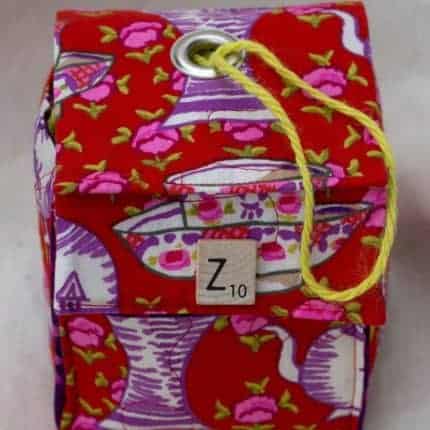 A red and purple bag with a Z Scrabble tile.