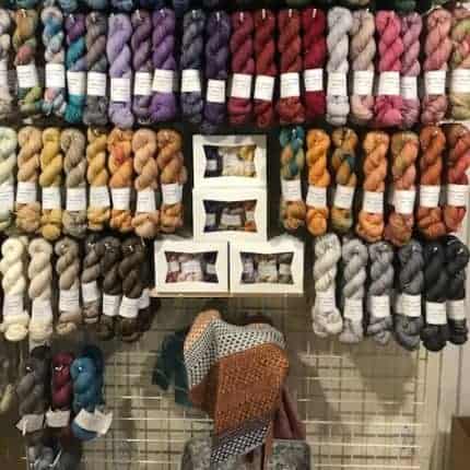 A wall of colorful yarn.