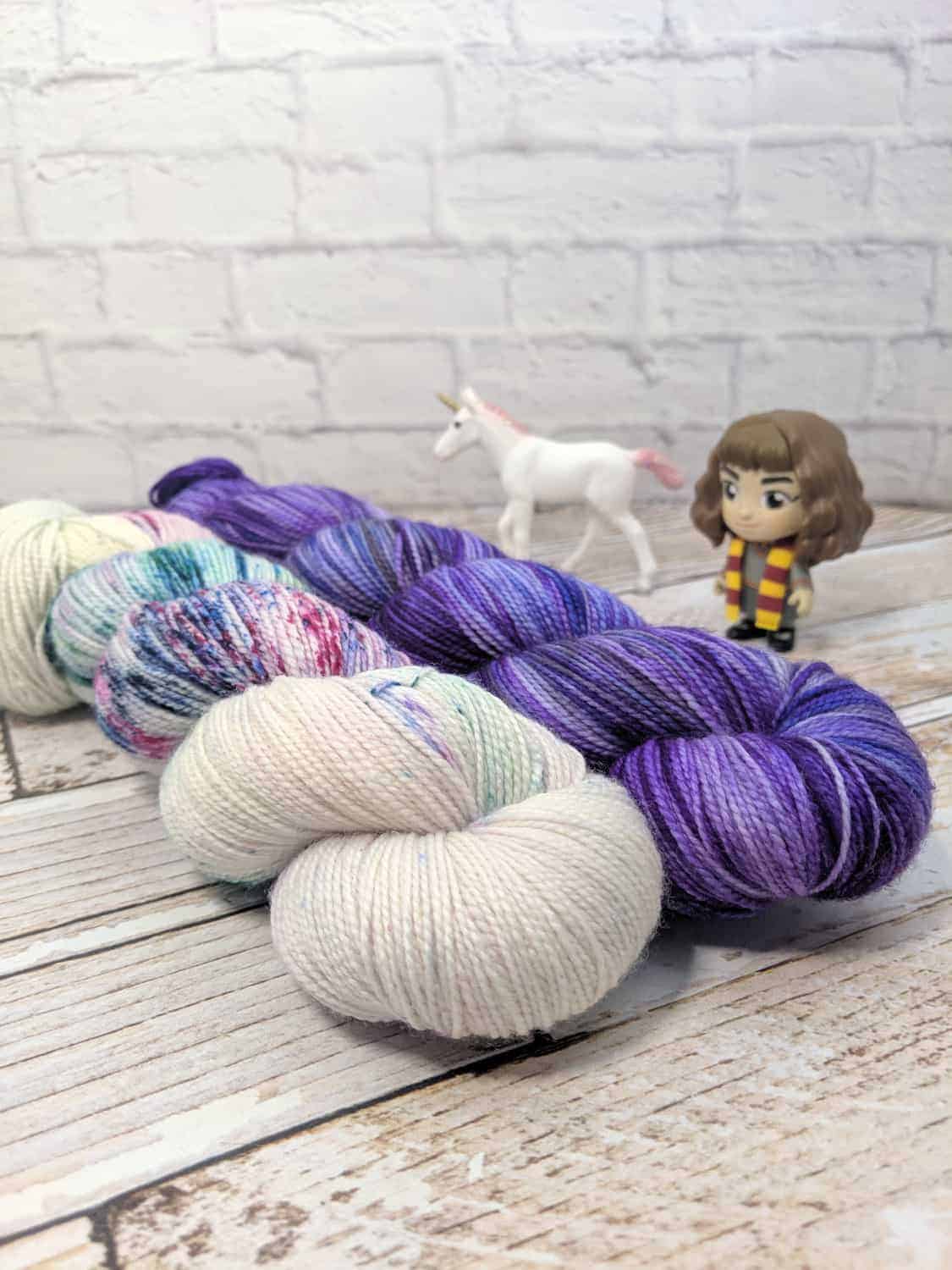 Purple and speckled yarn.