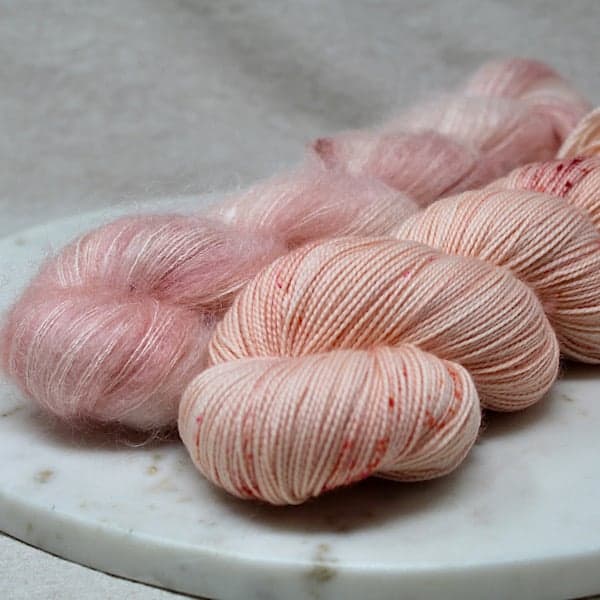 Pale pink speckled yarn.