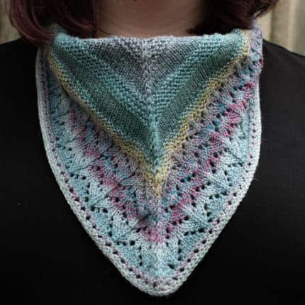 A green and pink lacy cowl.