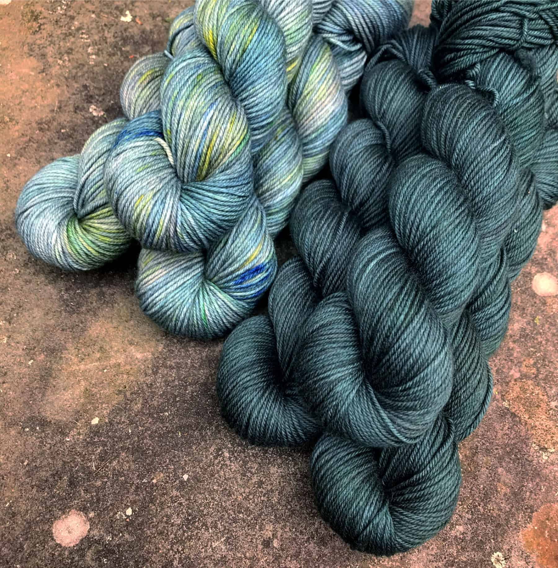 Teal and teal and green speckled yarn.