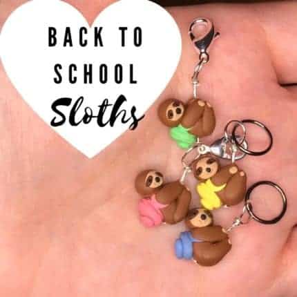 Sloths wearing colorful backpacks as stitch markers.