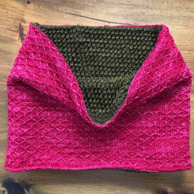 A hot pink cowl with a gray interior.