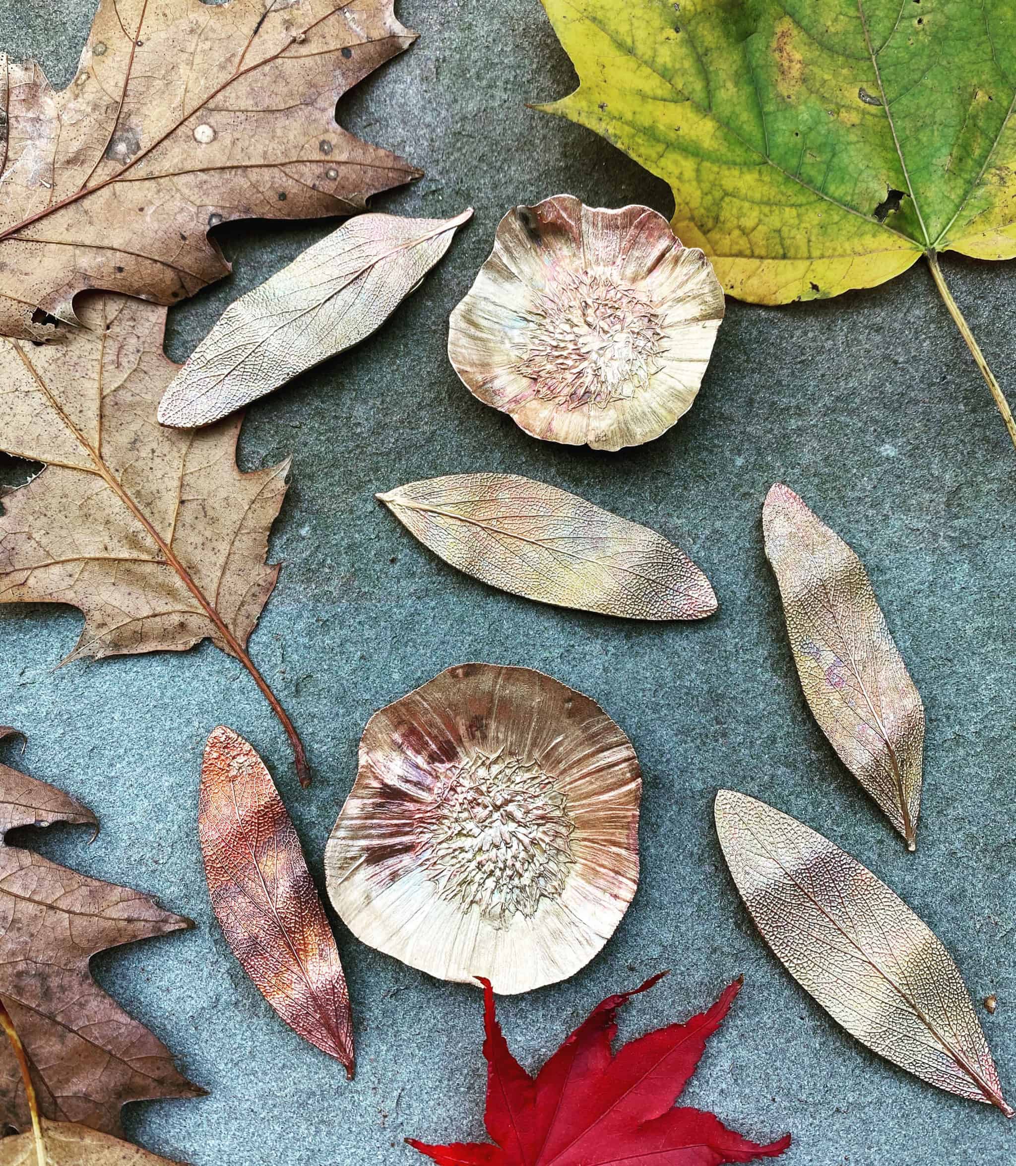 Leaves and leaf-shaped metal jewelry.