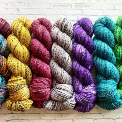 Colorful yarn with black stripes.