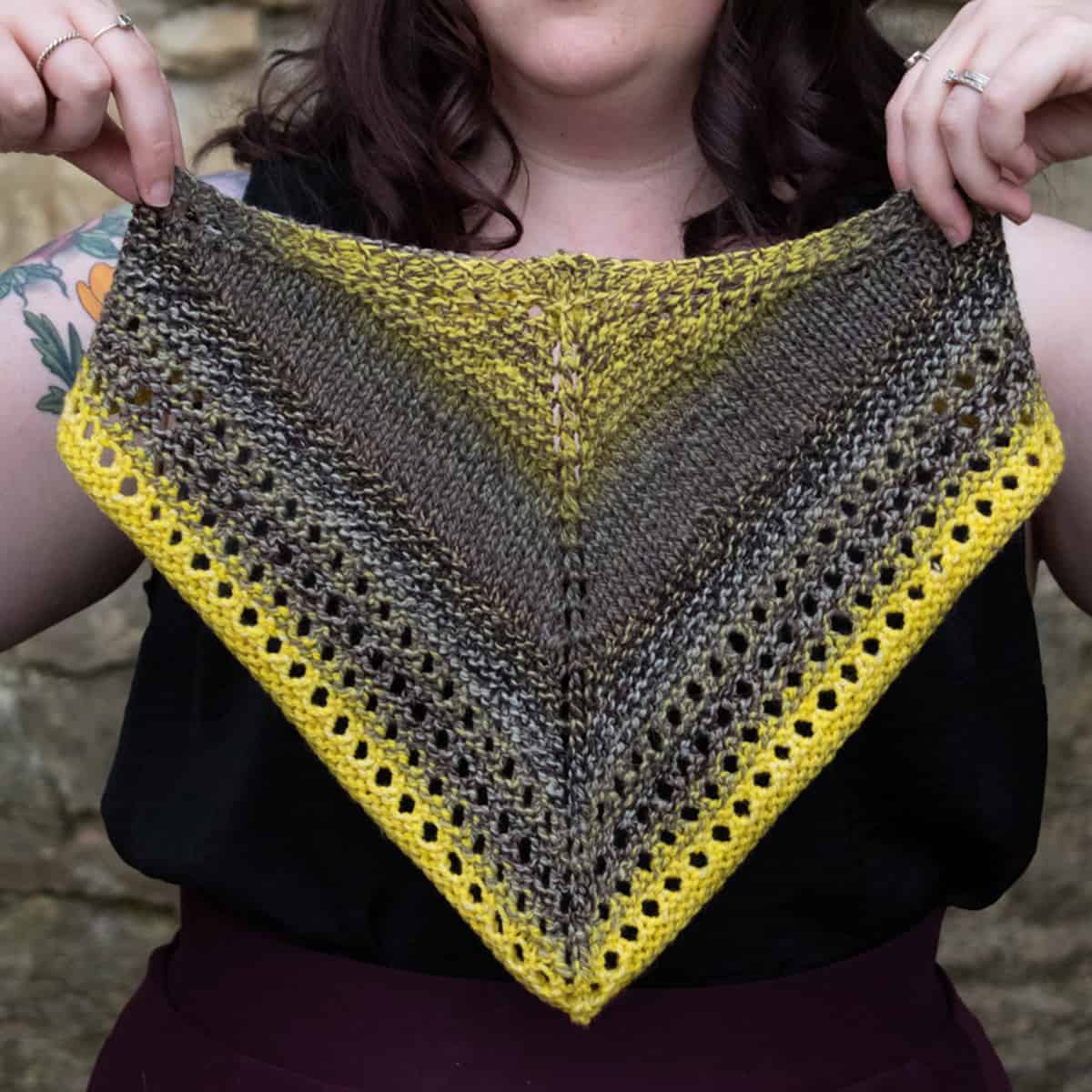 A gray and yellow triangle cowl. 