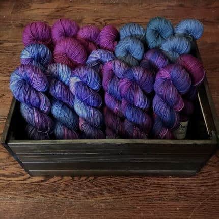 Skeins of purple and blue yarn.