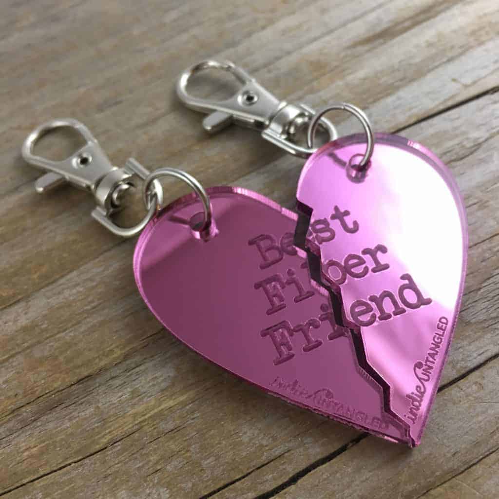 A pink mirrored heart with the words Best Fiber Friend.