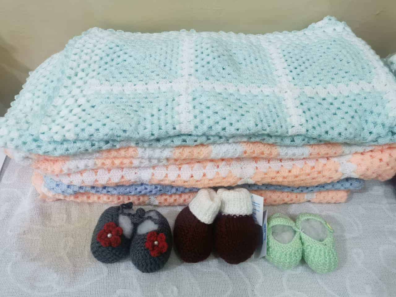 Crochet blankets and booties. 
