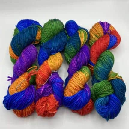 Skeins of blue, orange, purple, green and yellow yarn.