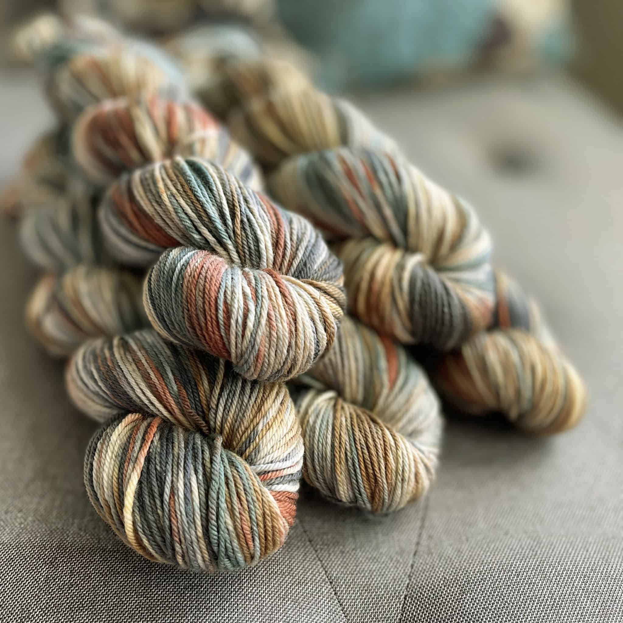 Beige yarn with red and blue.