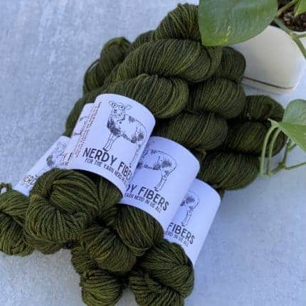 Skeins of mossy green yarn.