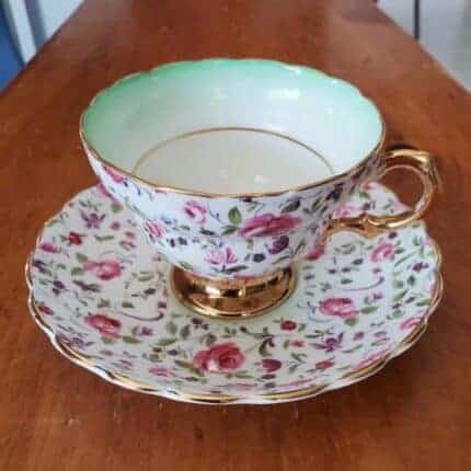 A teacup with pink flowers.