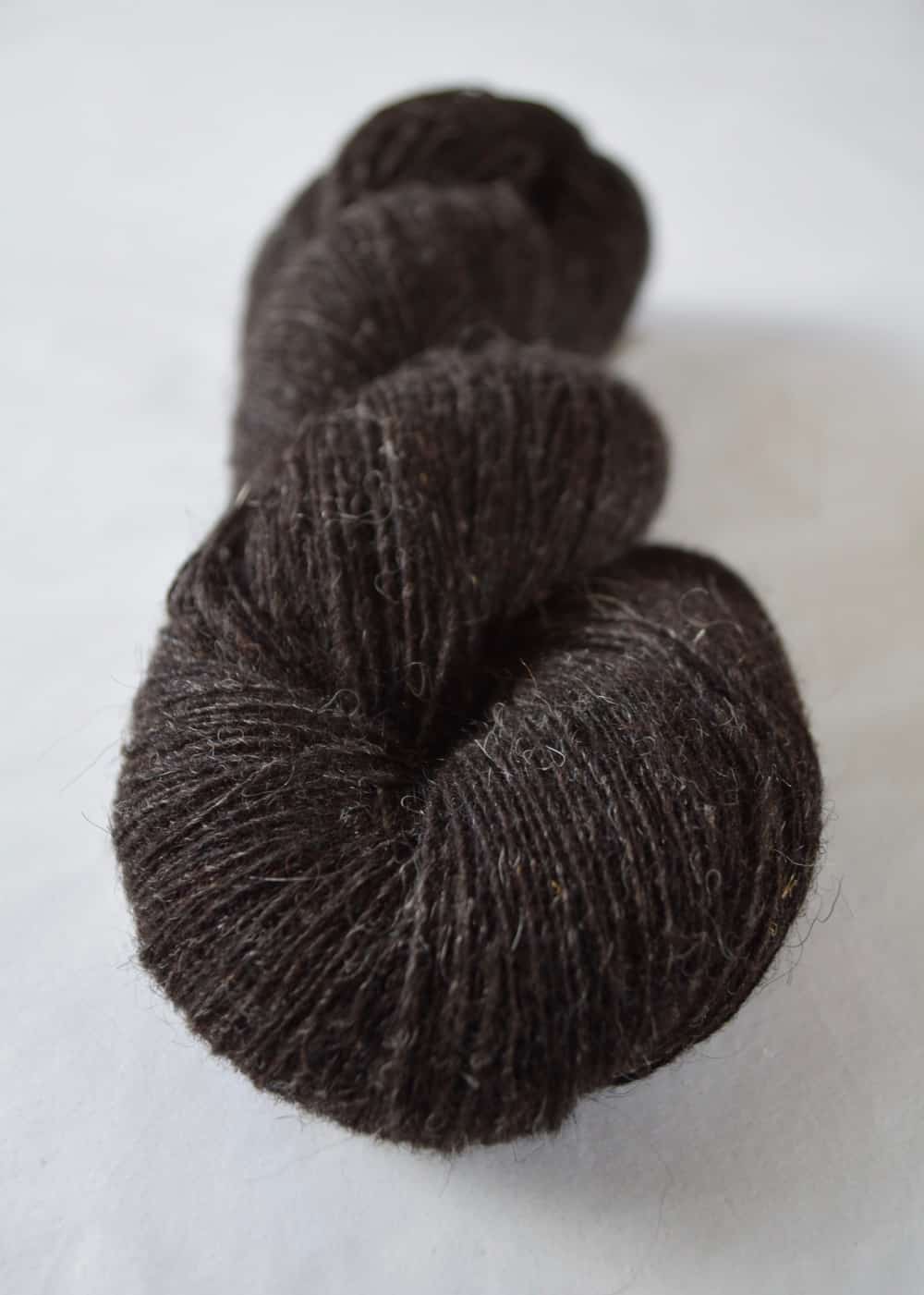 A skein of dark brown yarn.