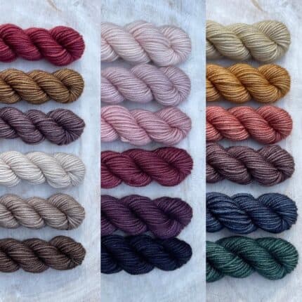 Sets of red, brown, purple and gray, pink, red and purple and gray gold, pink, purple, blue and green yarn.