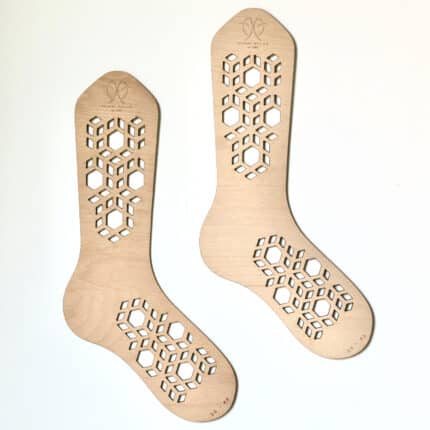 Sock-shaped wood with decorative holes.