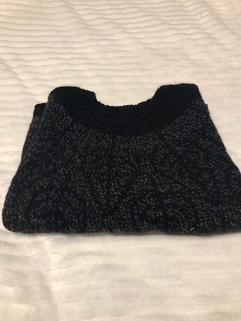 A black knit garment.