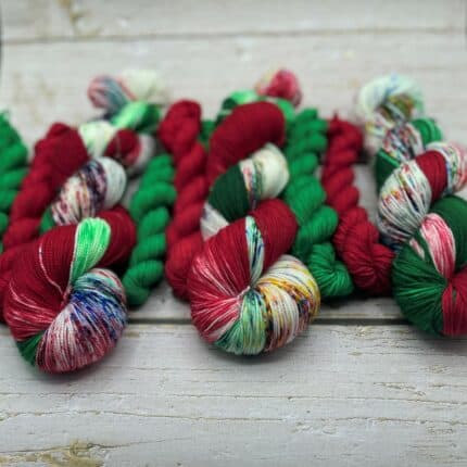 Skeins of red and green variegated yarn.