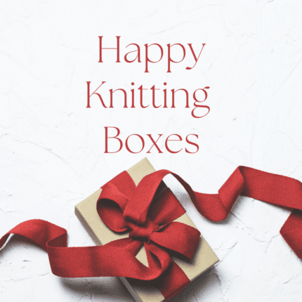 A red bow on a box and the words Happy Knitting Boxes.