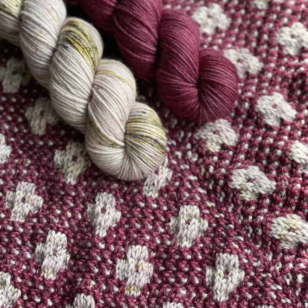 Purple and gray yarn on a floral knit.