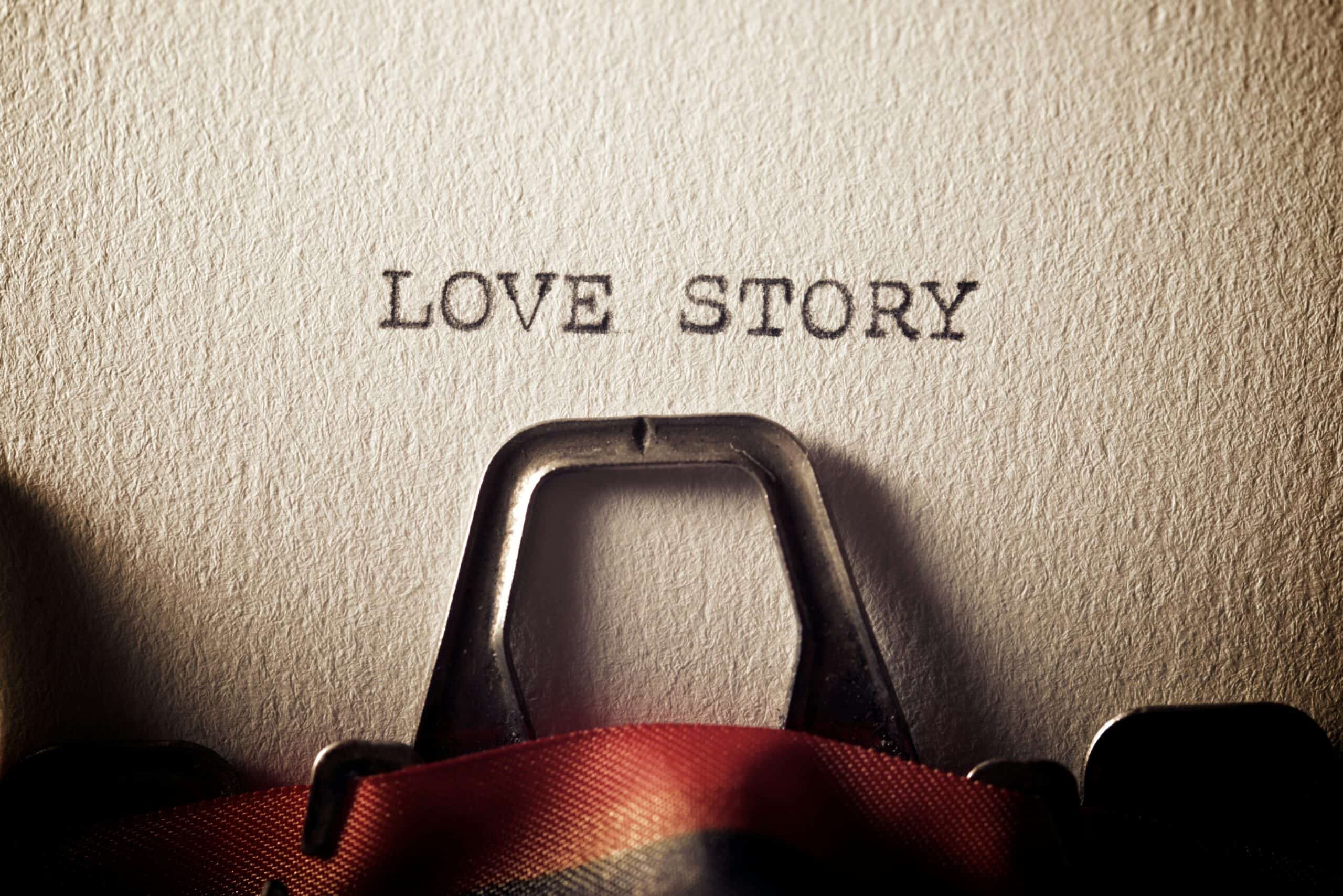The phrase LOVE STORY viewed in a typewriter. 