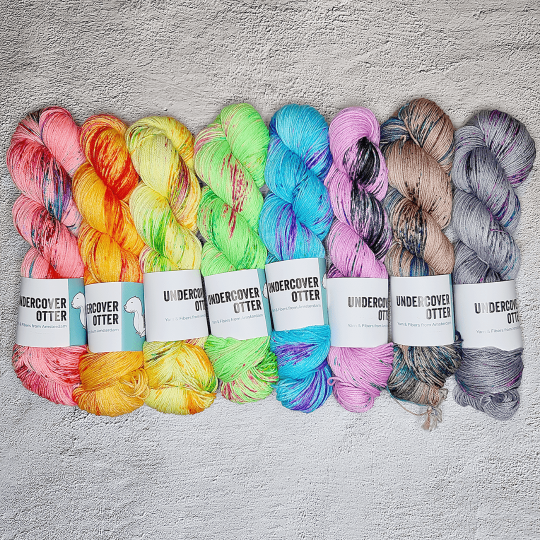 Skeins of bright fluorescent hand-dyed yarn.