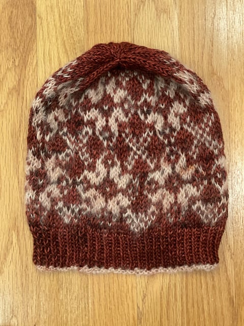 A red and white color work hat.