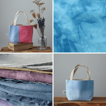 Two bags with blue tone, a pile of hand-dyed linen and some cotton dyed in blue.