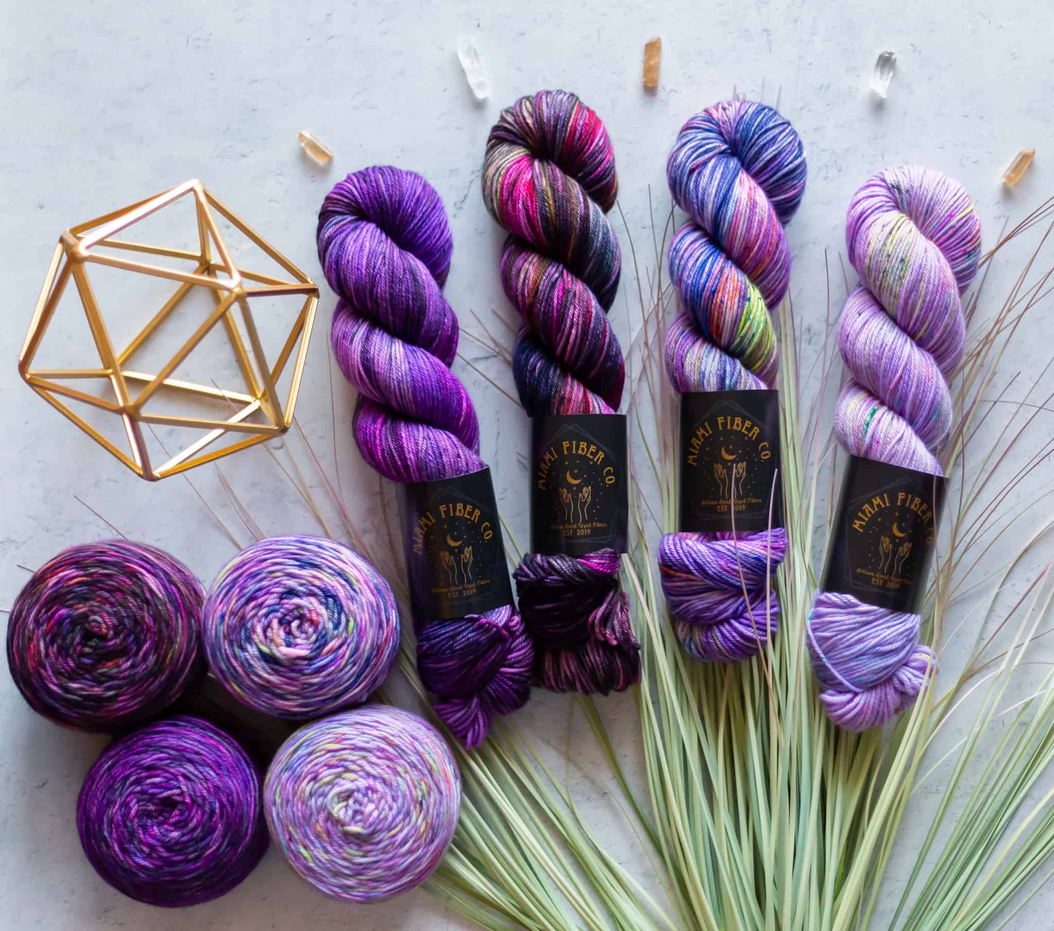Skeins of purple and pink speckled yarn.