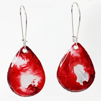 A pair of red teardrop shaped earrings.