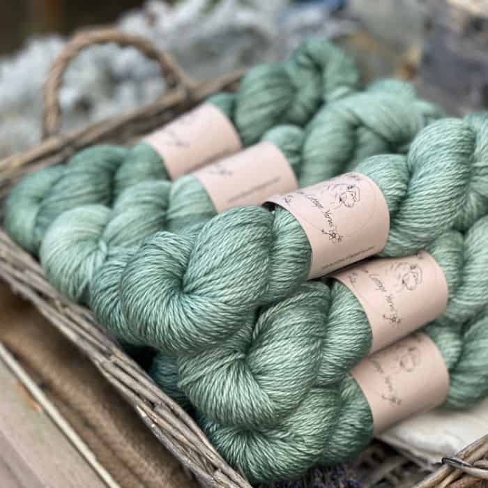Skeins of thick green yarn.