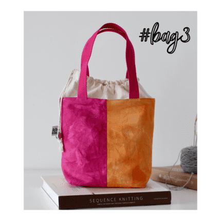 A pink and orange drawstring bag with pink handles.