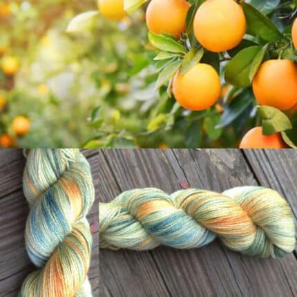 Skein of orange and sage green colored yarn.