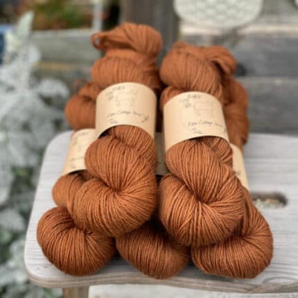 Five skeins of reddish-brown yarn.