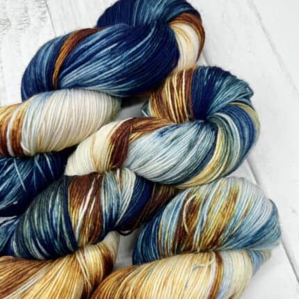 Blue and golden skeins of yarn.