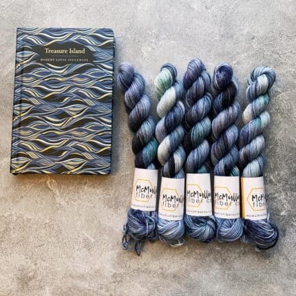 Blue mini skeins and a matching classic novel.