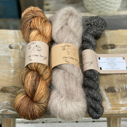 Yarns in shades of brown and grey.