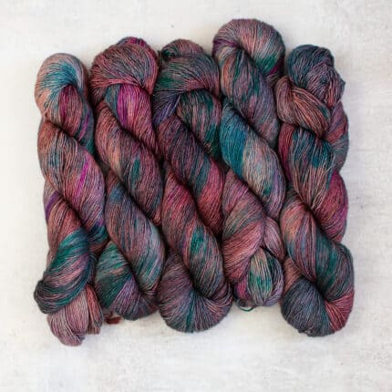 Skeins of variegated pink and blue hand-dyed yarn.
